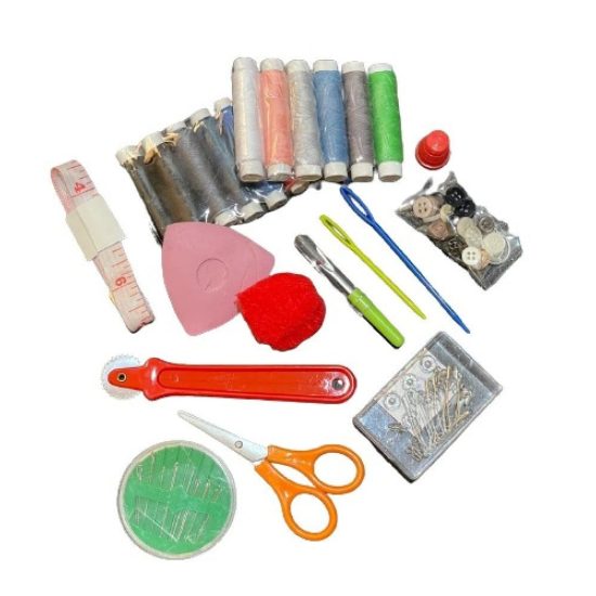 A Set of Assorted Sewing Tools with a Pattern Book and Carbon Paper
