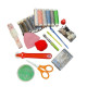 A Set of Assorted Sewing Tools with a Pattern Book and Carbon Paper